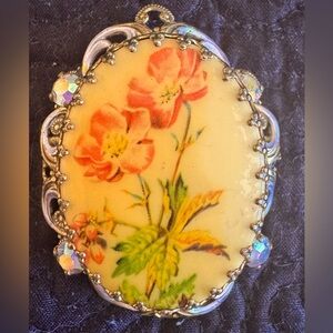 Vintage floral brooch framed in silver and gold filigree w mounted rhinestones